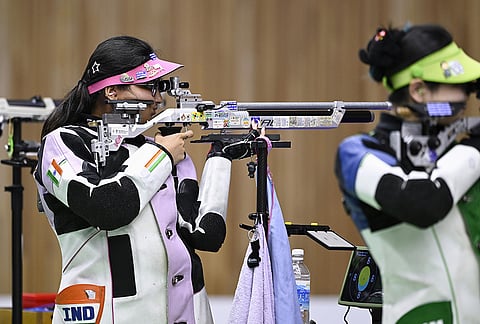 Sonam Uttam Maskar, left, of India competes in the qualification of the women's individual 10 meter air rifle event in shooting, in Toyota, Aichi prefecture, Sunday, Sept. 20, 2026. 