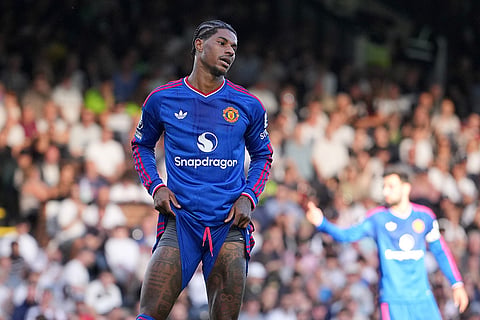 Manchester United's Marcus Rashford reacts after missing a chance to score during the English Premier League soccer match between Fulham and Manchester United in London.