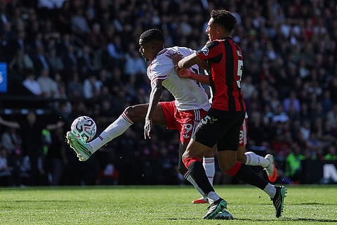 Liverpool's Alexander Isak, left, is tackled by Bournemouth's James Hill during the English Premier League soccer match between Bournemouth and Liverpool in Bournemouth, England.