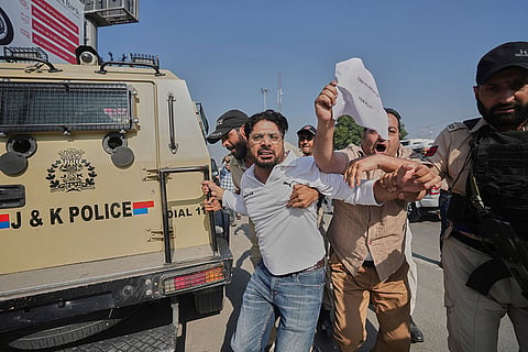 Police detain a supporter of the Jammu Kashmir Apni Party during a protest demanding jobs, opposing a power tariff hike and pressing other demands in Srinagar,  Kashmir.