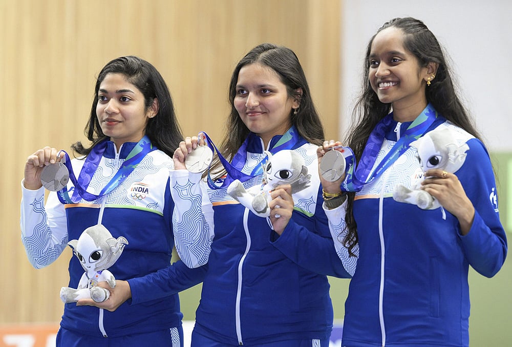 Members of India's women's 10 meter air rifle team, Vidarsa Kochalumkal Vinod, Sonam Uttam Maskar, and Elavenil Valarivan, pose with the silver medal in Toyota, Aichi prefecture, Sunday, Sept. 20, 2026.  - | Photo: Kasumi Fukudome/Kyodo News via AP