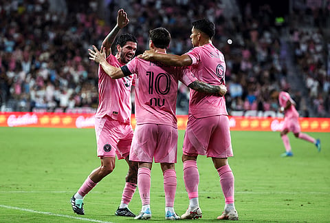 Inter Miami forward Lionel Messi (10) celebrates with midfielder Rodrigo De Paul, left, and forward Luis Suárez (9) after scoring on a free kick during the first half of an MLS soccer game against San Diego FC, Sunday, Sept. 20, 2026, in Miami. 