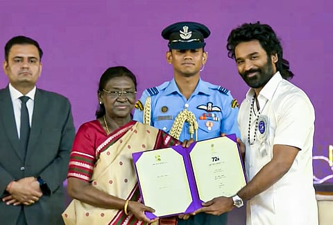 President Droupadi Murmu confers award for Special Mention (Performance) on actor Dhanush for his role in film 'Captain Miller' during the 72nd National Film Awards, at Kevadia, in Narmada district, Gujarat. 
