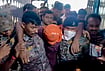 | Photo: PTI  : Security personnel carry an accused allegedly involved in the harassment of a boy and a girl by the roadside. 