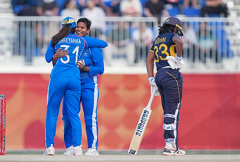 India's Deepti Sharma, center right, celebrates the wicket of Sri Lanka's Kaveesha Dilhari Walikonthagei with teammate India's Shreyanka Rajesh Patil during the women's gold medal T20 cricket game between India and Sri Lanka at the Asian Games in Nisshin, Japan, Tuesday, Sept. 22, 2026. 