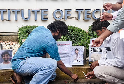 Demonstrators stage a candlelight protest to pay tribute to the suicide victims of IIT Bombay, in Mumbai, Monday, Sept. 21, 2026. 