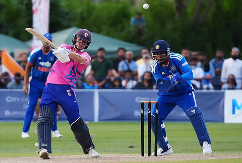 Japan's Kendel Kadowaki-Fleming, left, bats in front of India's Ishan Kishan during the Suzuki Cup T20 cricket match in Sano, Japan, Tuesday, Sept. 22, 2026, marking 75 years of diplomatic relations between the two countries. 