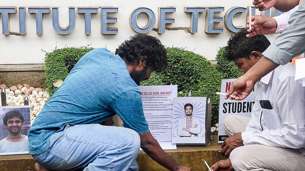 Demonstrators stage a candlelight protest to pay tribute to the suicide victims of IIT Bombay.  - | Photo: PTI 