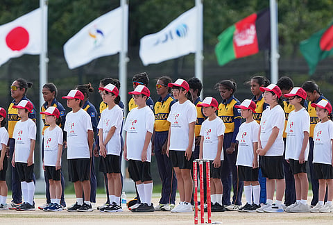 Team Sri Lanka stands for the national anthem before the start of the women's gold medal T20 cricket game between India and Sri Lanka at the Asian Games in Nisshin, Japan, Tuesday, Sept. 22, 2026.  