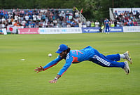 India Survive Japan Scare To Defend 32 In Nail-Biting Five-Over Thriller | Photo: AP/Tomohiro Ohsumi : India's Tilak Varma dives while fielding against Japan during the Suzuki Cup T20 cricket match in Sano, Japan, Tuesday, Sept. 22, 2026, marking 75 years of diplomatic relations between the two countries.