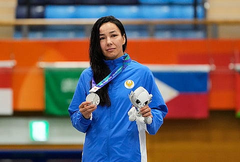 Silver medalists Sobirova Khiola of Uzbekistan stands on the podium during the medal ceremony for the women's traditional 60 kg mixed martial arts final at the Asian Games in Nagoya, Japan, Tuesday, Sept. 22, 2026.  