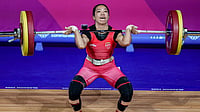 Asian Games 2026 Day 5 Preview: Full India Schedule, Match Timings, Medal Events & Live Streaming Details Photo: PTI/Ravi Choudhary : India's Mirabai Chanu competes in the women's 48kg Final weightlifting competition at the 23rd Commonwealth Games, in Glasgow, Scotland.