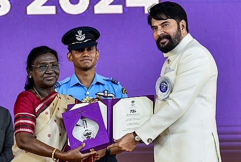 President Droupadi Murmu confers award for Best Actor in a Leading Role on Mammootty for his performance in the Malayalam film 'Bramayugamat' during the 72nd National Film Awards, at Kevadia, in Narmada district, Gujarat. 
