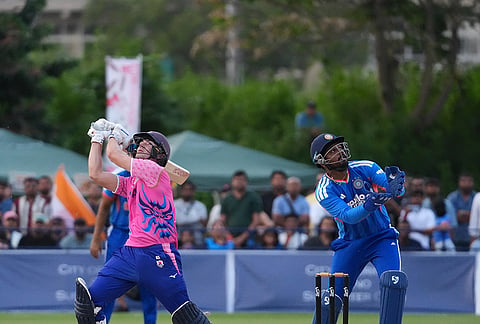 India's Sanju Samson, right, and Japan's Kendel Kadowaki-Fleming, look for the ball hit by Kadowaki-Fleming during the Suzuki Cup T20 cricket match in Sano, Japan, Tuesday, Sept. 22, 2026, marking 75 years of diplomatic relations between the two countries. 