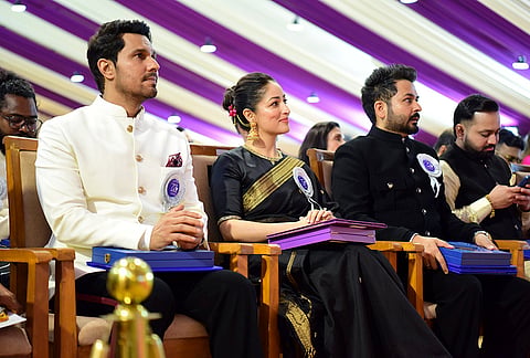 From left, actors Randeep Hooda, Yami Gautam Dhar and filmmaker Aditya Dhar during the 72nd National Film Awards, at Kevadia, in Narmada district, Gujarat. 
