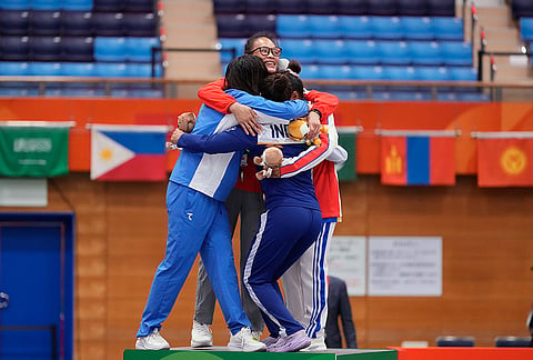 Medalists Sobirova Khiola of Uzbekistan, silver, Teo Hui Hoon, center, of Singapore, gold, Daalin Cheng of Cambodia and Suchika Tariyal of India, bronze, hug on the podium during the medal ceremony for the women's traditional 60 kg mixed martial arts final at the Asian Games in Nagoya, Japan, Tuesday, Sept. 22, 2026. 