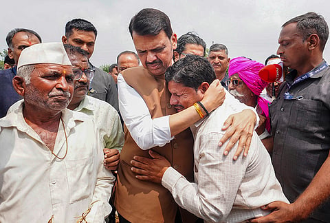 Maharashtra CM Devendra Fadnavis meets people affected by the drought-like situation in Jau, Nilanga taluka, Latur district. 