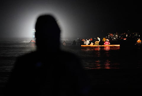A group of migrants try to cross the channel from France to Britain on a dinghy boat, in Hardelot, northern France, Wednesday, Sept. 23, 2026. 
