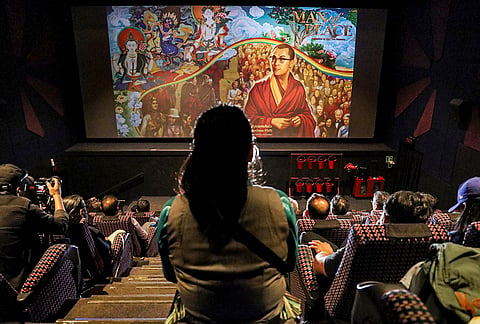 People watch the screening of the animated project 'Man of Peace', a biography on the Tibetan spiritual leader the Dalai Lama, at a movie theatre, in Dharamshala, Himachal Pradesh.