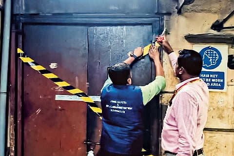 Raids & Seals: Food-safety department officials seal the Chairman’s Club & Resort kitchen in Bengaluru following an inspection