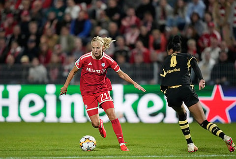 Bayern's Pernille Harder runs with the ball during the women's Champions League opening phase soccer match between FC Bayern Munich and Manchester City in Munich, Germany, Tuesday, Sept. 22, 2026. 