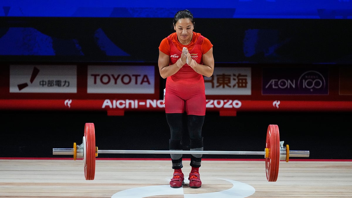 Mirabai Chanu Saikhom of India gestures as she competes during the women's 49kg weightlifting final at the Asian Games in Nagoya, Japan, Wednesday, Sept. 23, 2026 - (AP Photo/Dita Alangkara)