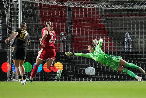Manchester City's Carlotta Wamser, left, scores her side's second goal past Bayern goalkeeper Ena Mahmutovic during the women's Champions League opening phase soccer match between FC Bayern Munich and Manchester City in Munich, Germany, Tuesday, Sept. 22, 2026. 