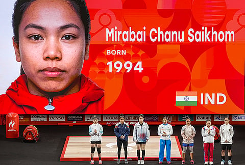 India’s Mirabai Chanu and other competitors arrive to compete in the Women’s 49kg Group A weightlifting final match during the 20th Asian Games, in Nagoya, Japan, Wednesday, Sept. 23, 2026. 