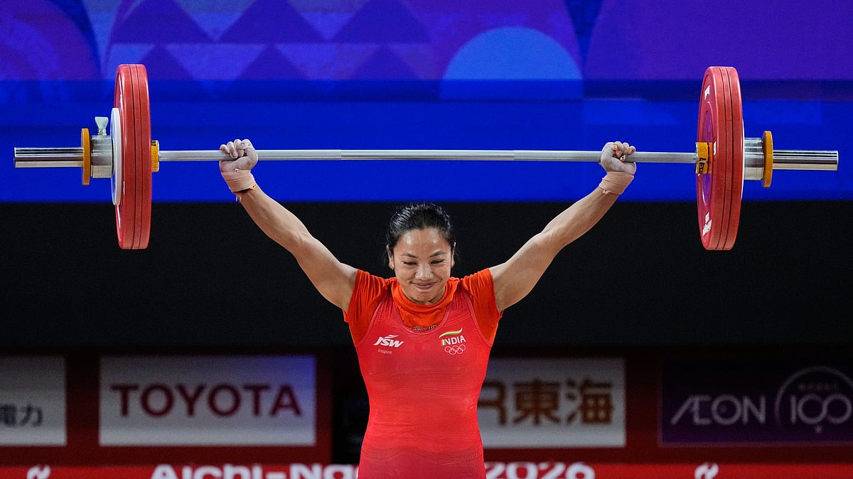 (AP Photo/Dita Alangkara) : Mirabai Chanu Saikhom of India competes during the women's 49kg weightlifting final at the Asian Games in Nagoya, Japan, Wednesday, Sept. 23, 2026.