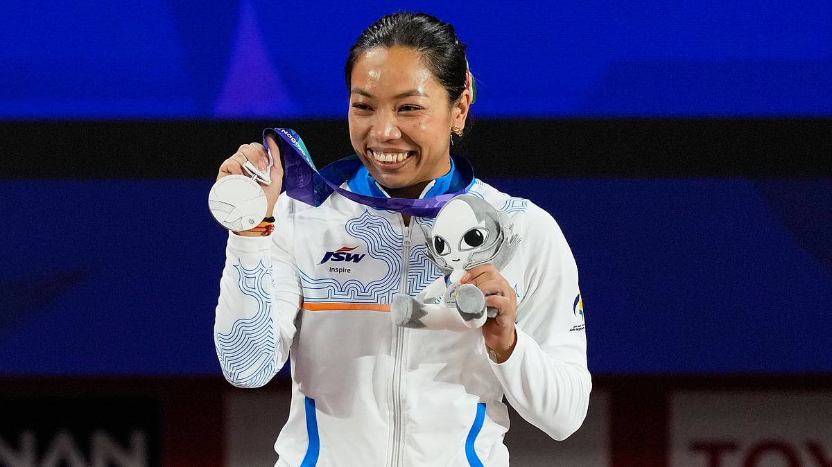 Silver medalist Mirabai Chanu Saikhom of India poses on the podium after the women's 49kg weightlifting final at the Asian Games in Nagoya, Japan, Wednesday, Sept. 23, 2026 - (AP Photo/Dita Alangkara)