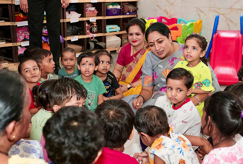 Delhi Chief Minister Rekha Gupta interacts with children during a visit to the Anganwadi Centre at MCD Primary Co-Ed School, Sarai Kale Khan.  - | Photo: @CMODelhi/X via PTI 