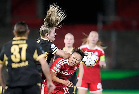 Manchester City's Lauren Hemp collides with Bayern's Momoko Tanikawa, right, during the women's Champions League opening phase soccer match between FC Bayern Munich and Manchester City in Munich, Germany, Tuesday, Sept. 22, 2026. 