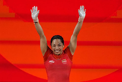 Mrabai Chanu Saikhom of India celebrates after her successful lift as she competes during the women's 49kg weightlifting final at the Asian Games in Nagoya, Japan, Wednesday, Sept. 23, 2026. 