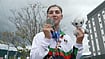 SNTV via AP : Afghanistan's Fariba Hashim displays the silver medal she won for Women's Road Race.