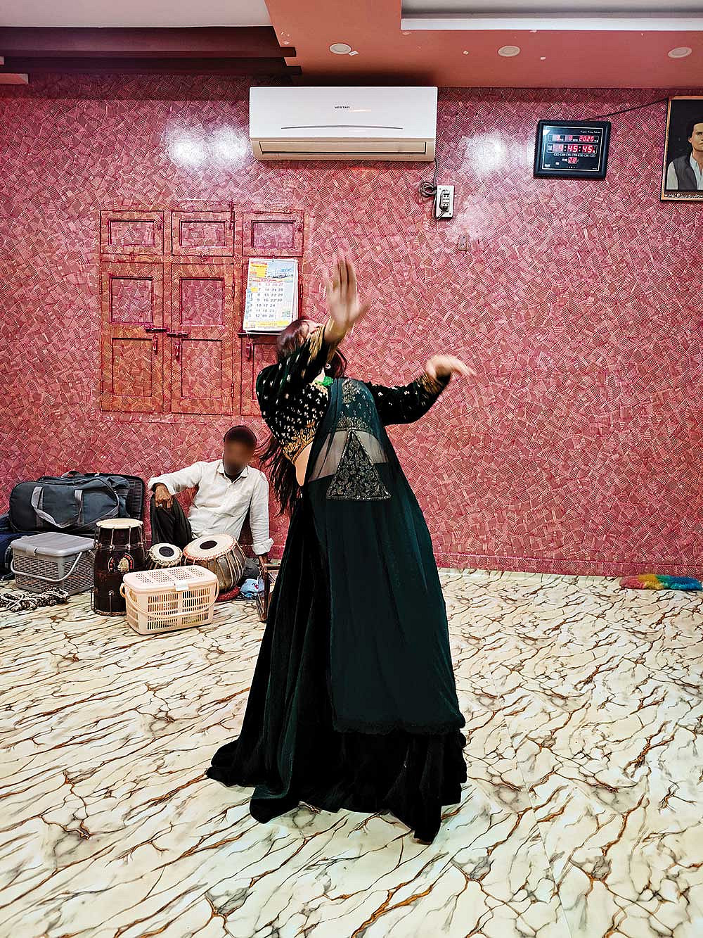Modern Performances: A dancer performs during a mehfil 