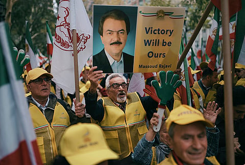 Demonstrators holding a photo of Iran opposition leader Massoud Rajavi protest against the Iranian government outside United Nations headquarters during the U.N. General Assembly on Tuesday, Sept. 22, 2026, in New York. 