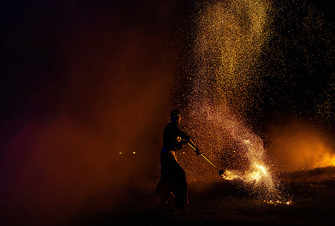 People participate in fire rituals during the Autumn Equinox celebration in Vilnius, Lithuania.