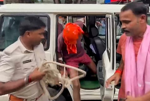 Security personnel escort Nandan Yadav, the main accused in the Jamui minor girl harassment case, to a special POCSO court, in Jamui, Bihar, Wednesday, Sept. 23, 2026. 