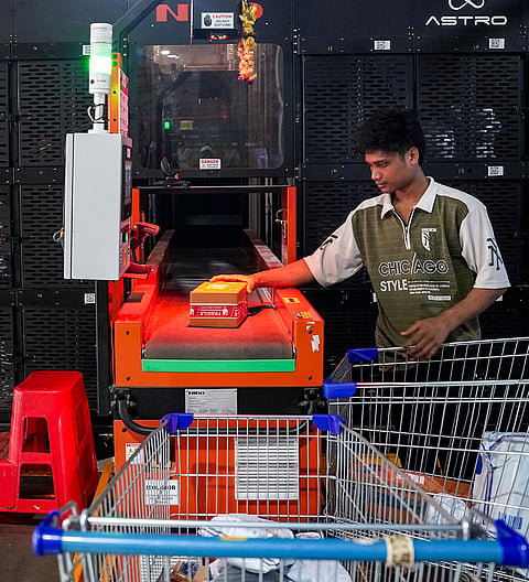 A worker scans products at the Flipkart fulfillment center ahead of 'The Big Billion Days 2026' sale, in Bengaluru, Karnataka, Wednesday, Sept. 23, 2026.