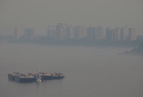 A fuel barge is seen on the Negro River, as smoke from wildfires fills the air in Manaus, Amazonas state, Brazil, Wednesday, Sept. 23, 2026.