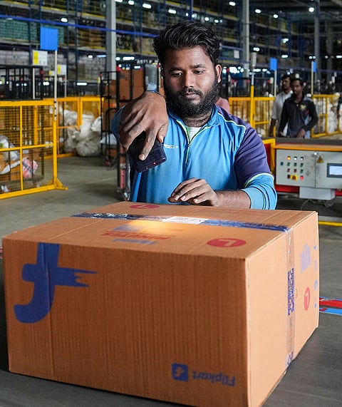 A worker scans an outbound box at the Flipkart fulfillment center ahead of 'The Big Billion Days 2026' sale, in Bengaluru, Karnataka, Wednesday, Sept. 23, 2026.