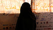 Gaza Gender Violence Reports Jump 60% As Child Marriage Soars 123%: UNFPA | Photo: UNFPA Palestine/Yasmeen Sous : Inside the Haydar Abdel Shafi Centre in Gaza, a woman reflects before a wall of collective voices calling for dignity and an end to violence