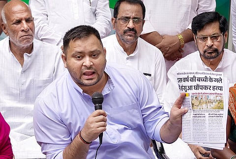 RJD leader Tejashwi Yadav addresses a press conference over the alleged sexual assault of a minor girl in Jamui, at his official residence, in Patna, Tuesday, Sept. 22, 2026. 