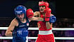 Photo: AP/Eranga Jayawardena : England's Ruby White, left, is punched by India's Sakshi Chaudhary during the women's 51kg boxing final at the Commonwealth Games in Glasgow, Scotland.