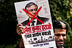| Photo: PTI/Karma Bhutia : A protestor holds a poster of Chief Election Commissioner (CEC) Gyanesh Kumar during a protest by Indian Youth Congress (IYC) members against the CEC, in New Delhi, Wednesday, Sept. 23, 2026. 