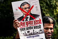 | Photo: PTI/Karma Bhutia : A protestor holds a poster of Chief Election Commissioner (CEC) Gyanesh Kumar during a protest by Indian Youth Congress (IYC) members against the CEC, in New Delhi, Wednesday, Sept. 23, 2026. 