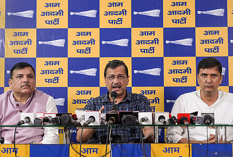 Former Delhi chief minister and Aam Aadmi Party (AAP) chief Arvind Kejriwal, centre, party MP Sanjay Singh and the party’s Delhi chief Saurabh Bharadwaj address a press conference, in New Delhi, Wednesday, Sept. 23, 2026. Kejriwal on Wednesday demanded that the entire SIR exercise be cancelled and that the Chief Election Commissioner (CEC) Gyanesh Kumar should immediately be arrested, citing an Indian Express report that two Election Commissioners had objected to the Election Commission's (EC) steps 14 times in 10 months amid the voter roll clean-up exercise. 