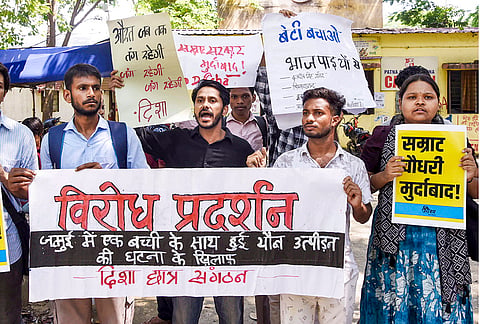 Members of Disha Students' Organisation stage protest against Bihar government following the viral video showing a boy and a girl allegedly being harassed by a group of people on a roadside in Jamui district, at Patna college, in Patna, Tuesday, Sept. 22, 2026. 