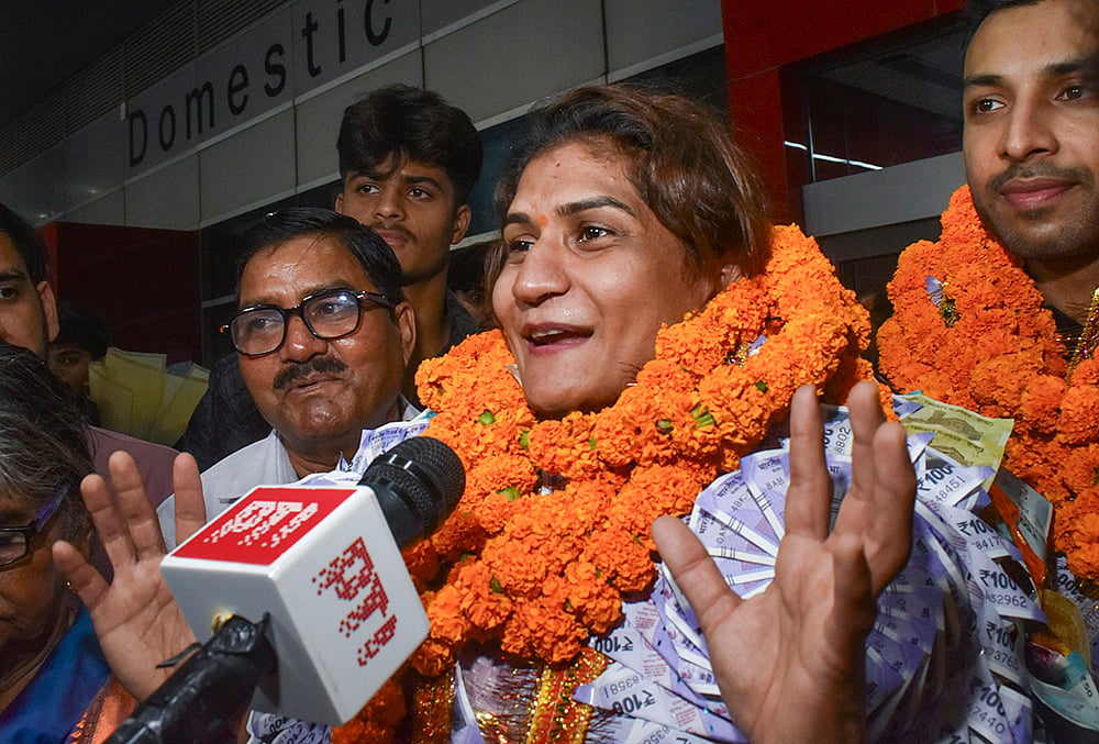 Indian mixed martial arts (MMA) athlete Suchika Tariyal addresses media upon her arrival at the Indira Gandhi International Airport after winning a bronze medal at the Asian Games 2026, in New Delhi. - | Photo: PTI/Rushikesh More