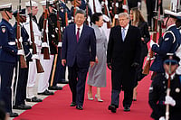 | Photo: AP/Mark Schiefelbein : President Donald Trump and first lady Melania Trump greet Chinese President Xi Jinping and his wife Peng Liyuan as they arrive at Joint Base Andrews, Md., Wednesday, Sept. 23, 2026.